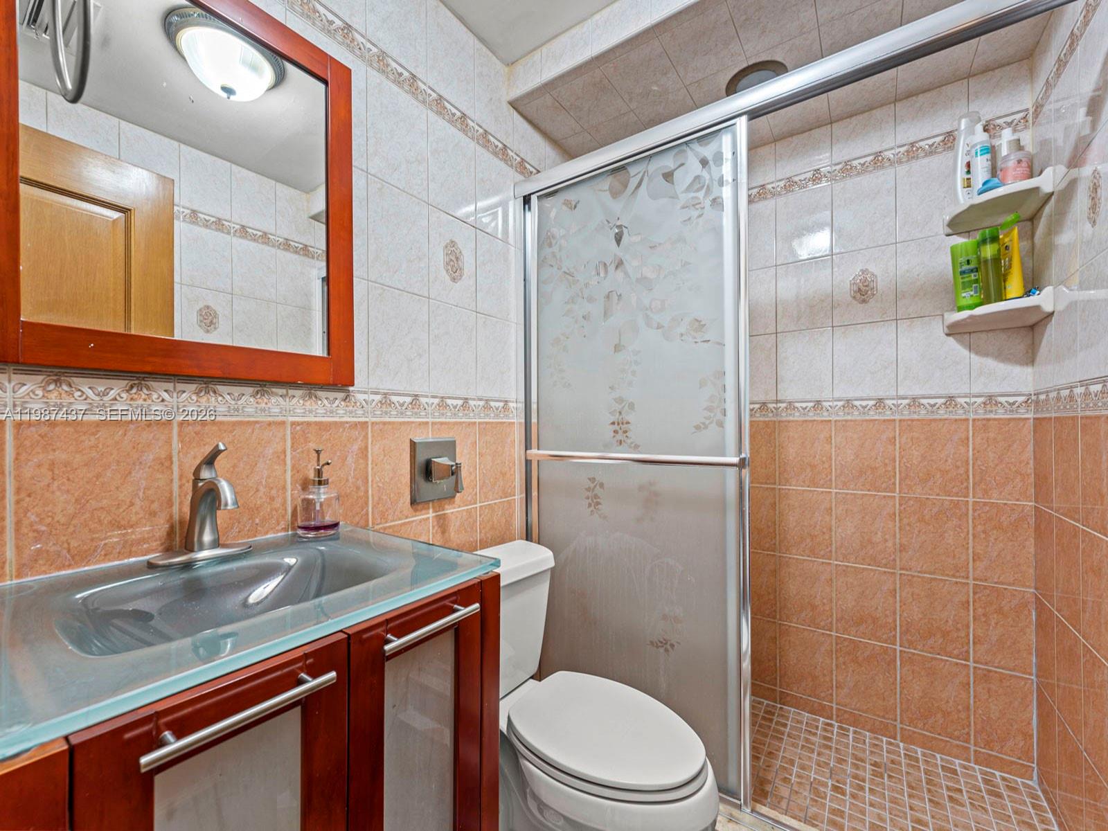 871 Southeast 5th Place Hialeah, FL 33010 - Photo 25 of 39 a bathroom with a sink a toilet and shower