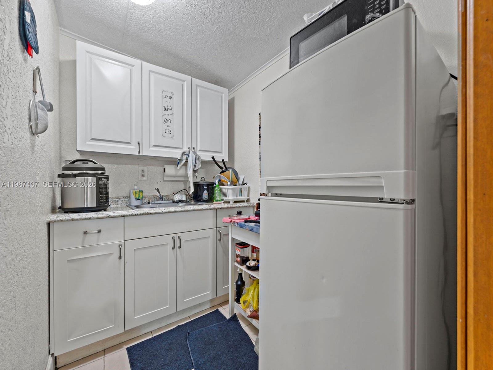 871 Southeast 5th Place Hialeah, FL 33010 - Photo 29 of 39 a room with storage and utility