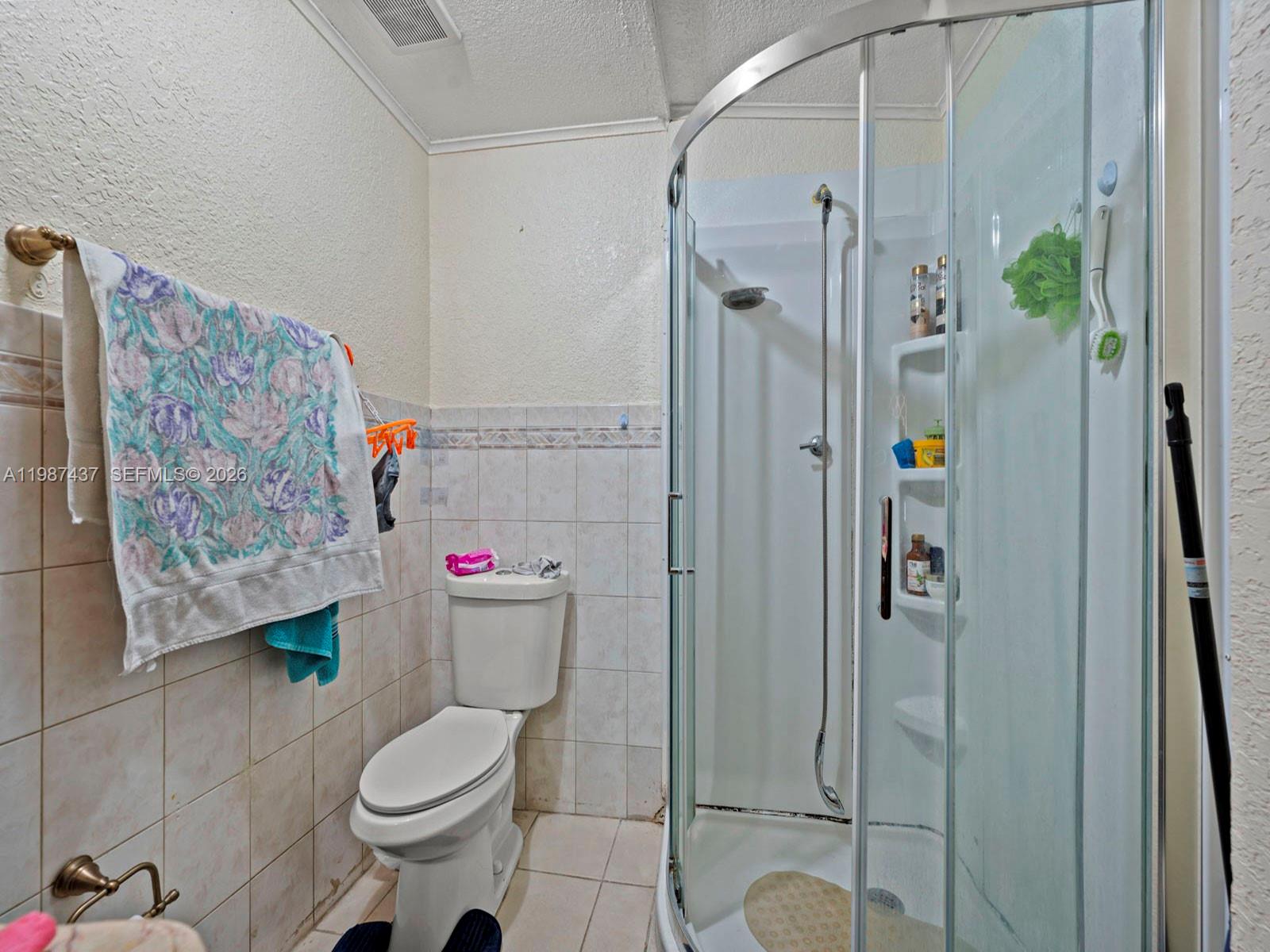 871 Southeast 5th Place Hialeah, FL 33010 - Photo 30 of 39 a bathroom with a toilet and shower