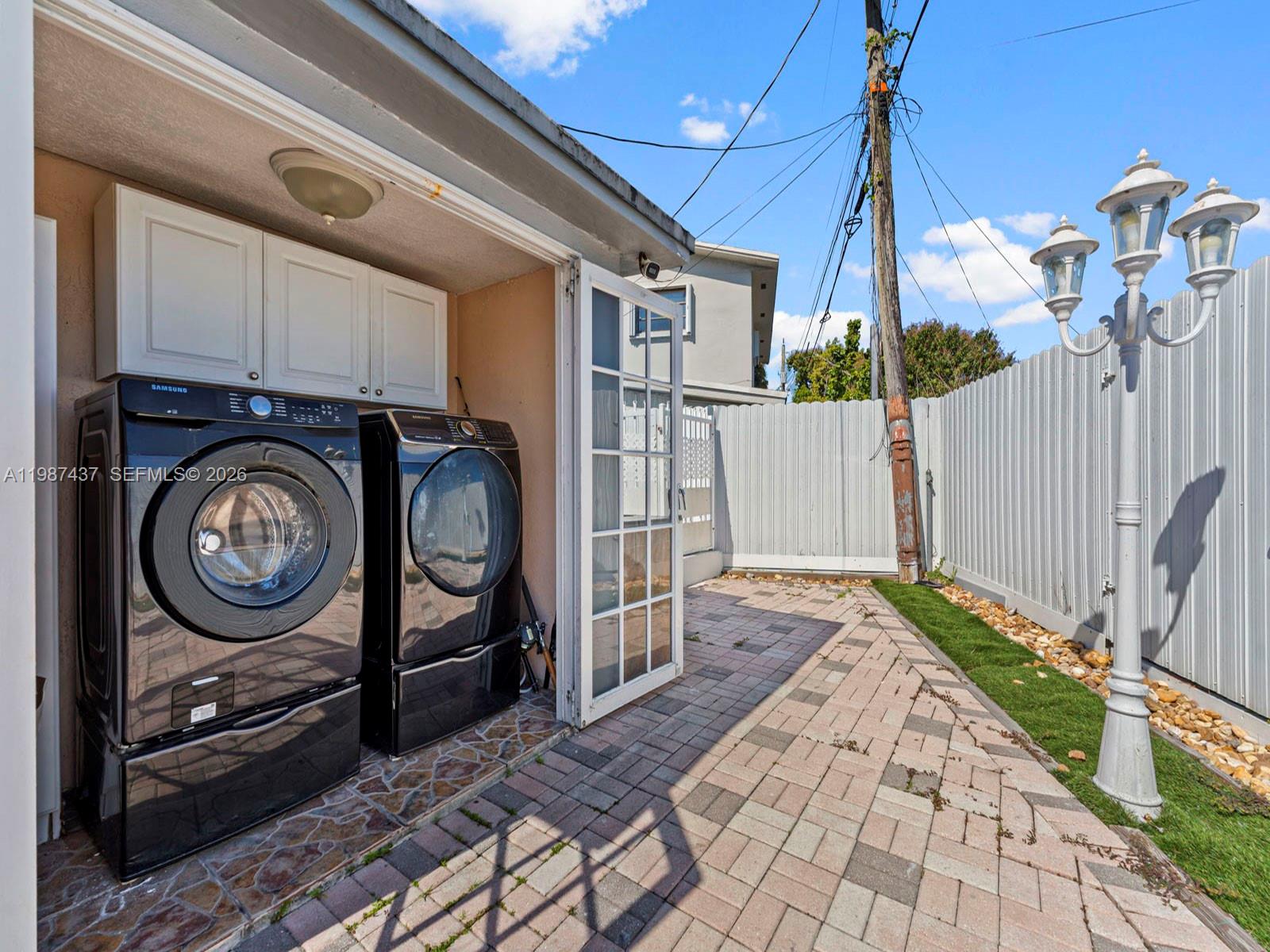 871 Southeast 5th Place Hialeah, FL 33010 - Photo 32 of 39 a view of a pathway of a house with a small yard