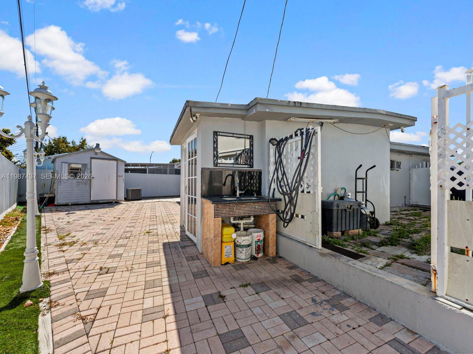 871 Southeast 5th Place Hialeah, FL 33010 - Photo 33 of 39 a front view of a house with shower