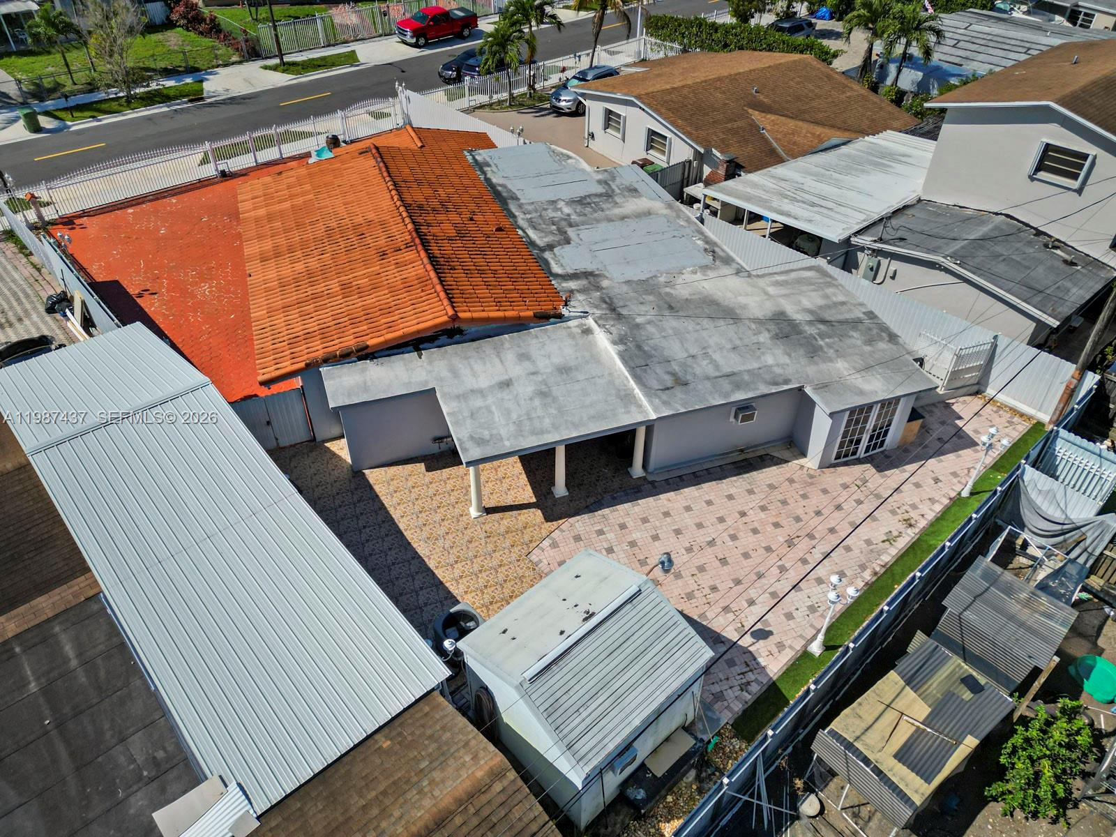 871 Southeast 5th Place Hialeah, FL 33010 - Photo 4 of 39 an aerial view of a house with roof deck