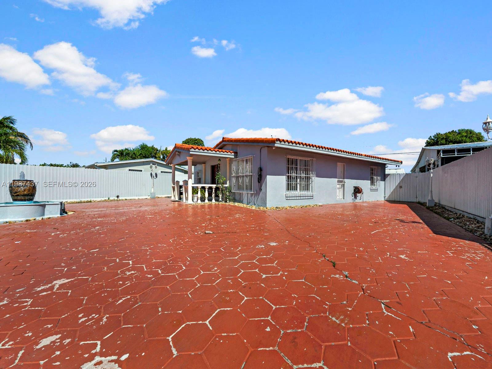 871 Southeast 5th Place Hialeah, FL 33010 - Photo 6 of 39 a patio with table and chairs