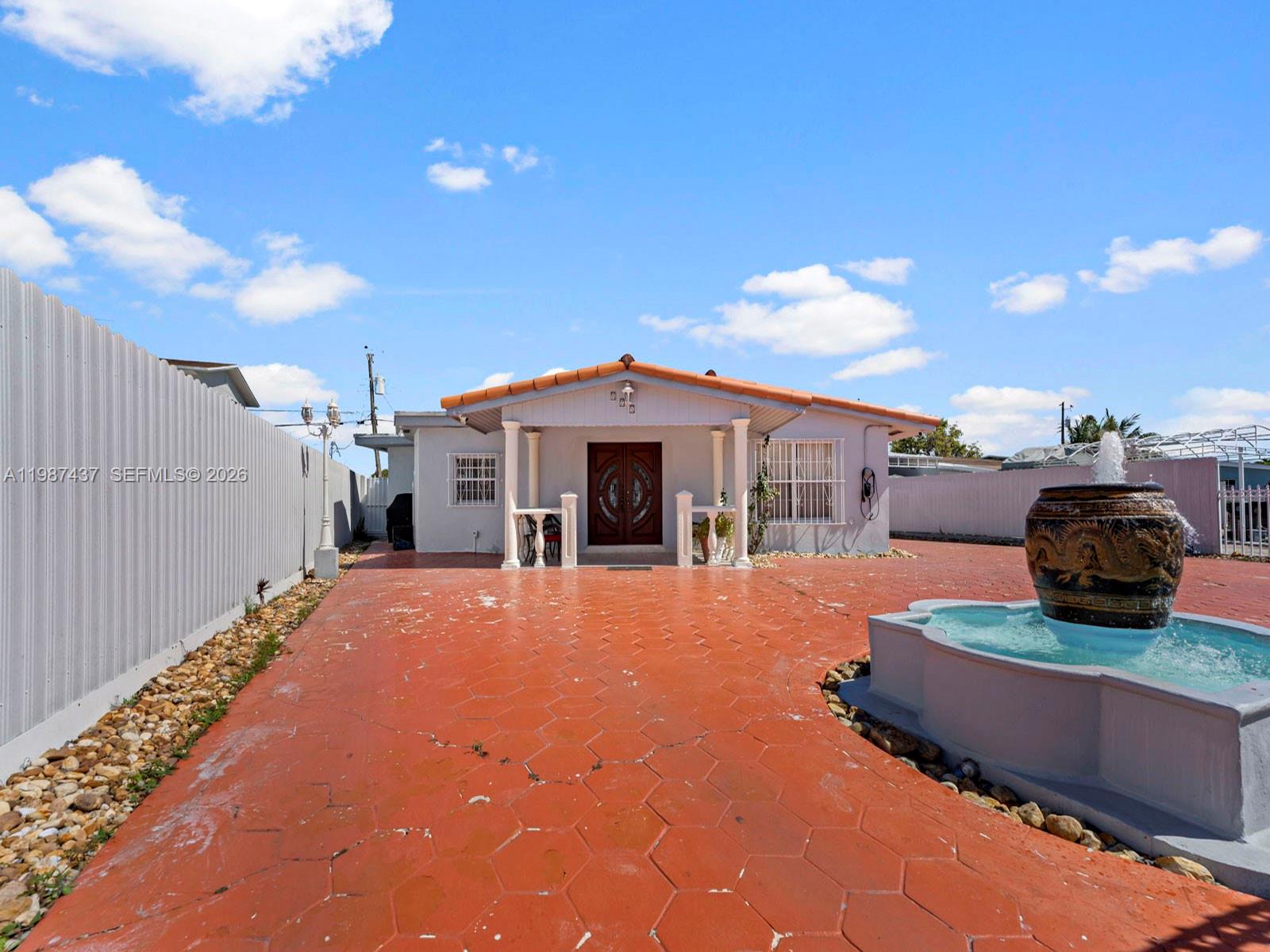 871 Southeast 5th Place Hialeah, FL 33010 - Photo 7 of 39 a front view of a house with stainless steel appliances