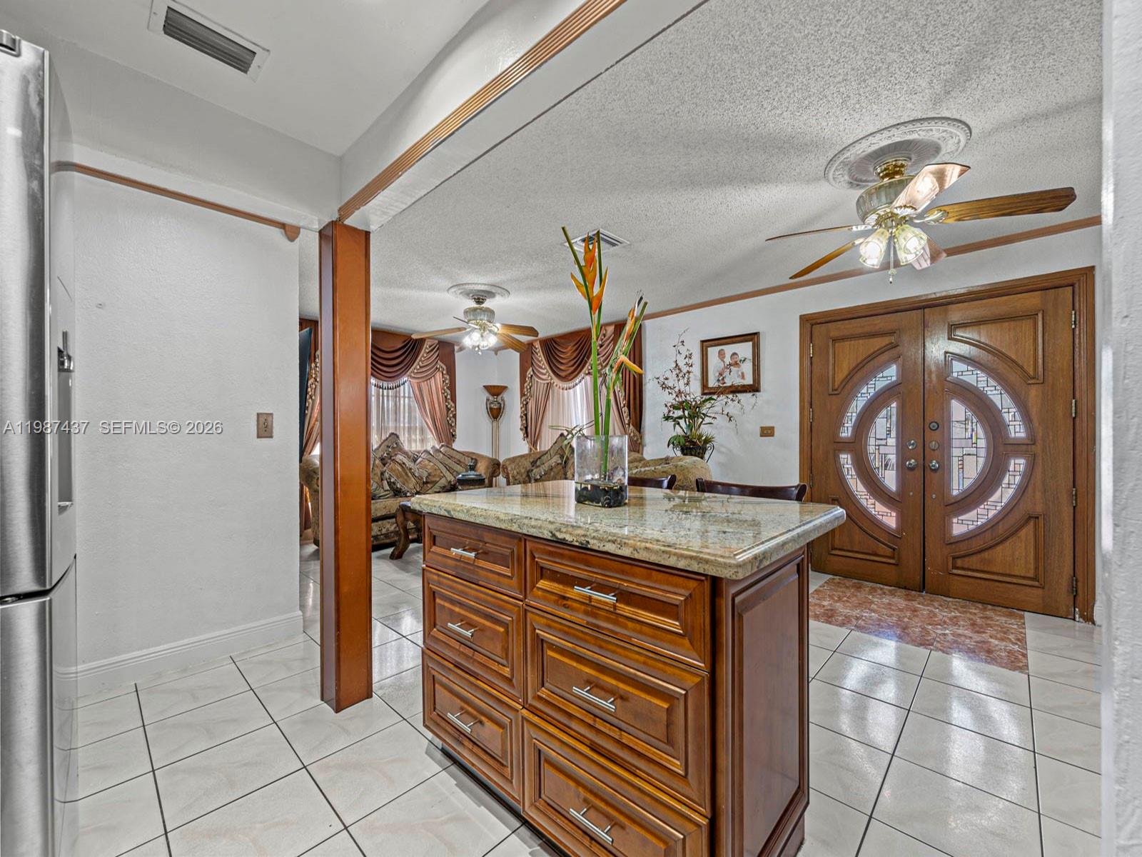 871 Southeast 5th Place Hialeah, FL 33010 - Photo 9 of 39 a room with a sink a washer and dryer