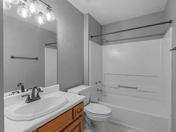 a view of small house with a yard