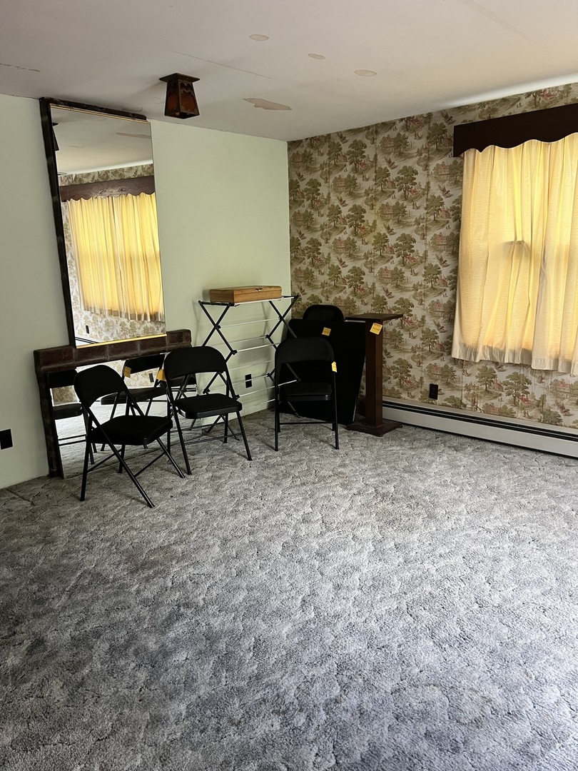 356 East Fulton Street Paxton, IL 60957 - Photo 11 of 25 a living room with furniture and a fireplace