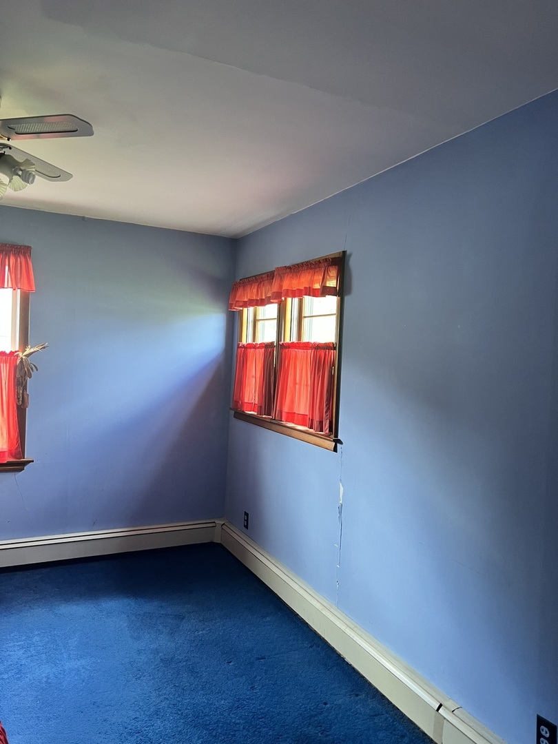 356 East Fulton Street Paxton, IL 60957 - Photo 12 of 25 an empty room with a window