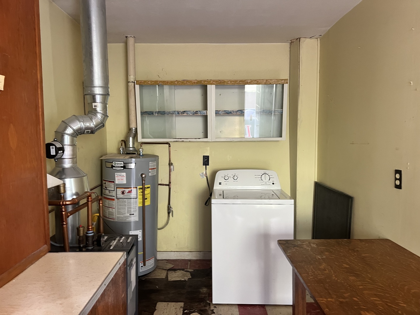 356 East Fulton Street Paxton, IL 60957 - Photo 24 of 25 a view of washer and dryer with kitchen in the background