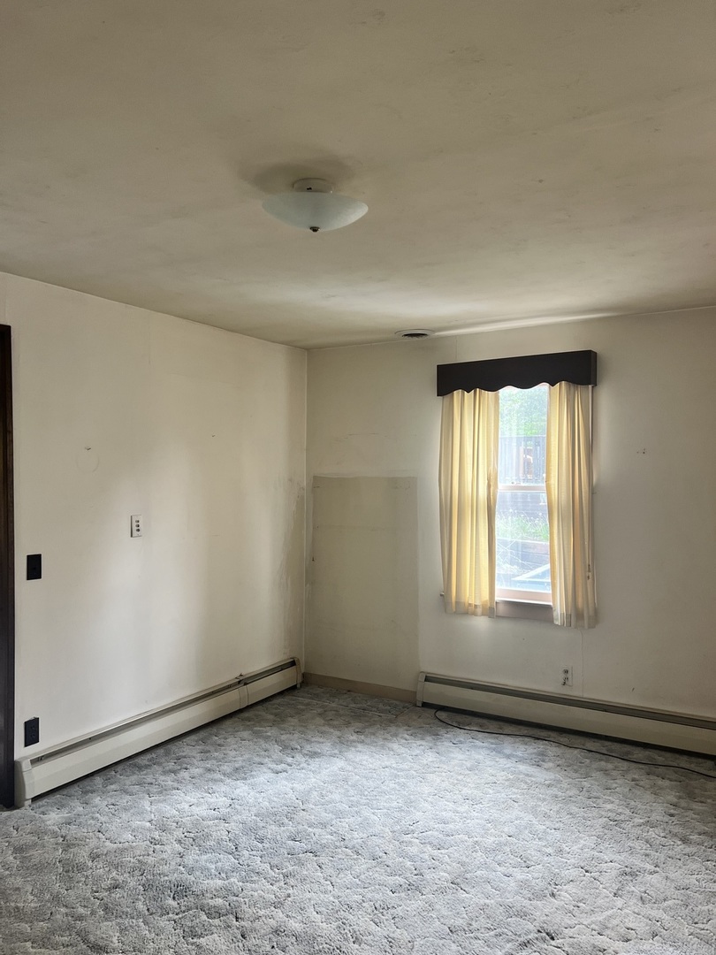 356 East Fulton Street Paxton, IL 60957 - Photo 25 of 25 an empty room with a window