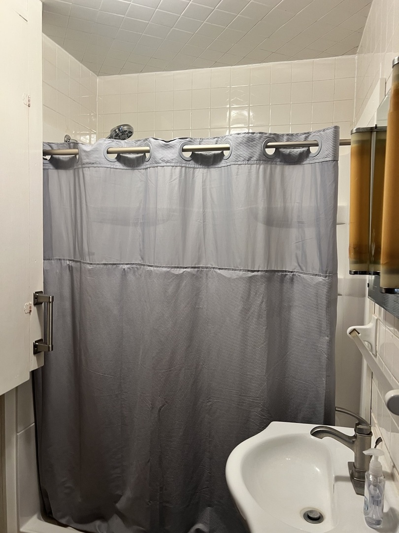 356 East Fulton Street Paxton, IL 60957 - Photo 6 of 25 a bathroom with a sink and a mirror