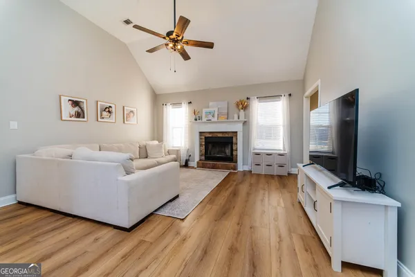 a living room with furniture and a flat screen tv