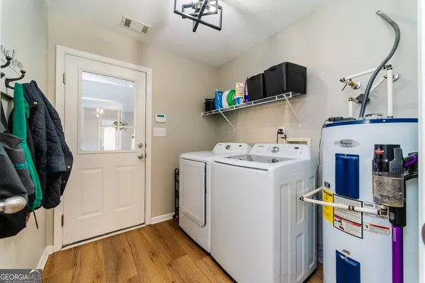 a view of storage and utility room with washer and dryer