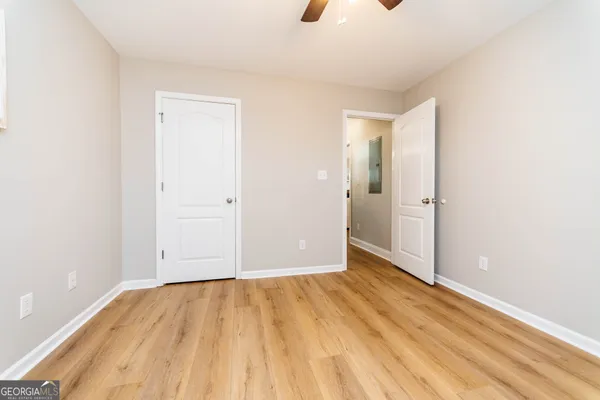 an empty room with wooden floor