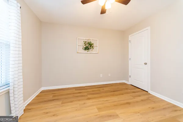 an empty room with a empty space and a window