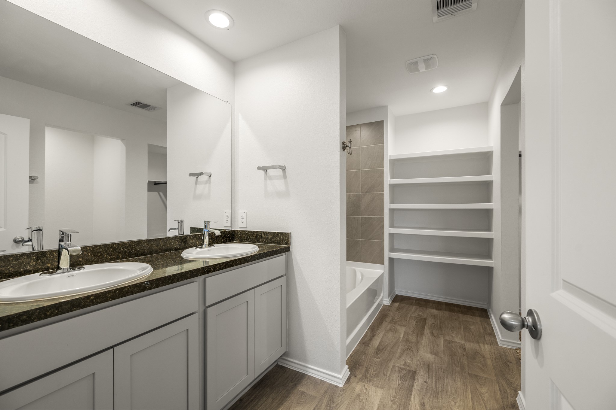 5402 Auburn Gardens Court Spring, TX 77373 - Photo 12 of 31 a bathroom with a granite countertop sink a toilet and a mirror