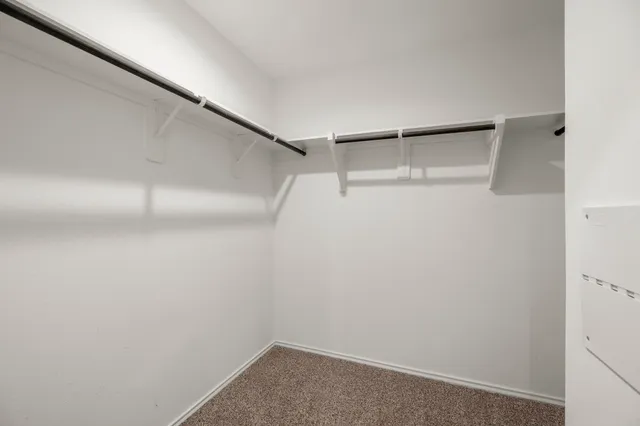 a view of an empty walk in closet
