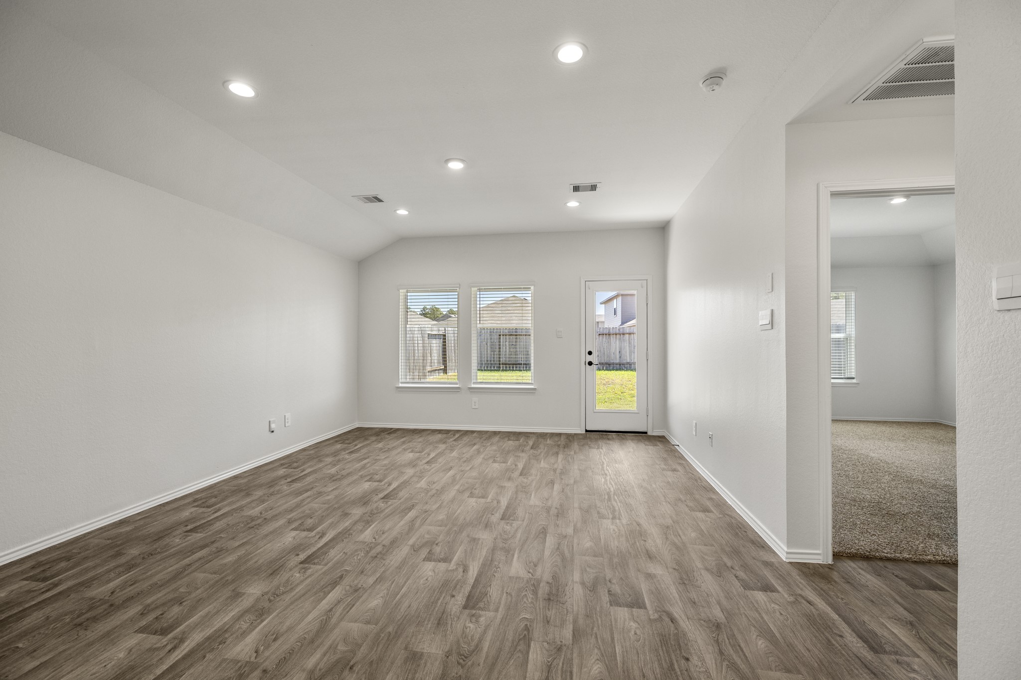 5402 Auburn Gardens Court Spring, TX 77373 - Photo 24 of 31 wooden floor in an empty room with a window