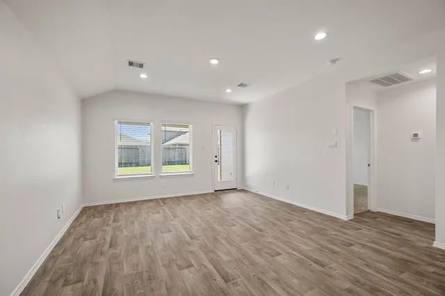 a view of a storage & utility room with wooden floor