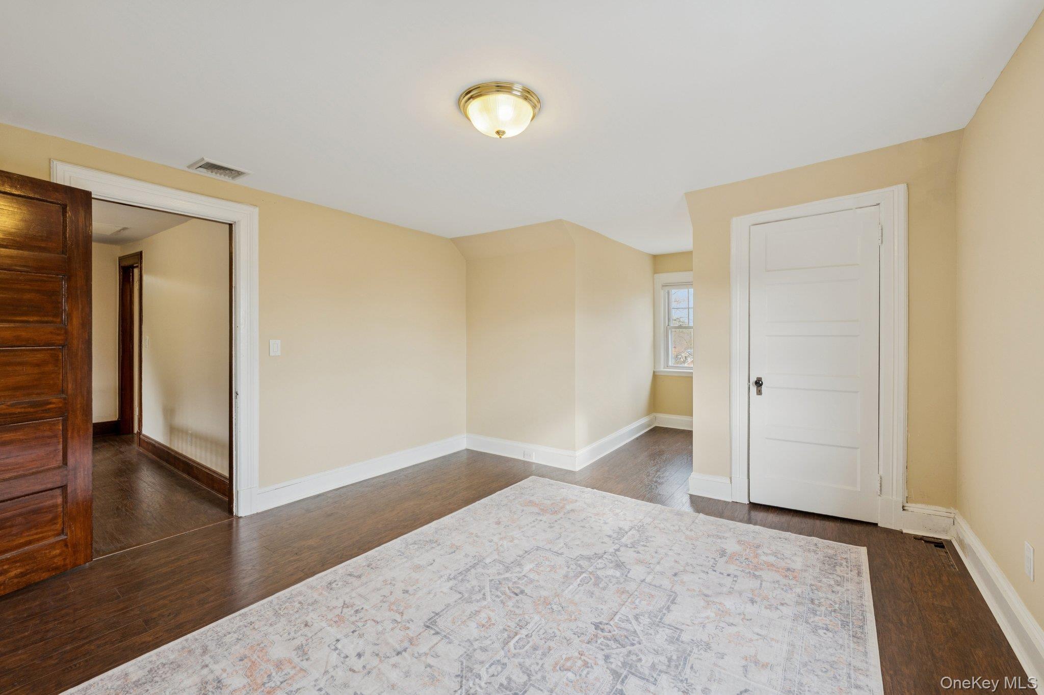 397 Split Rock Road Syosset, NY 11791 - Photo 24 of 29 a view of hallway with wooden floor