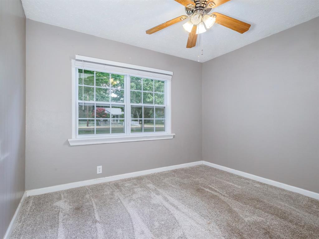 4002 Austin Avenue Brownwood, TX 76801 - Photo 18 of 34 a view of an empty room with a window
