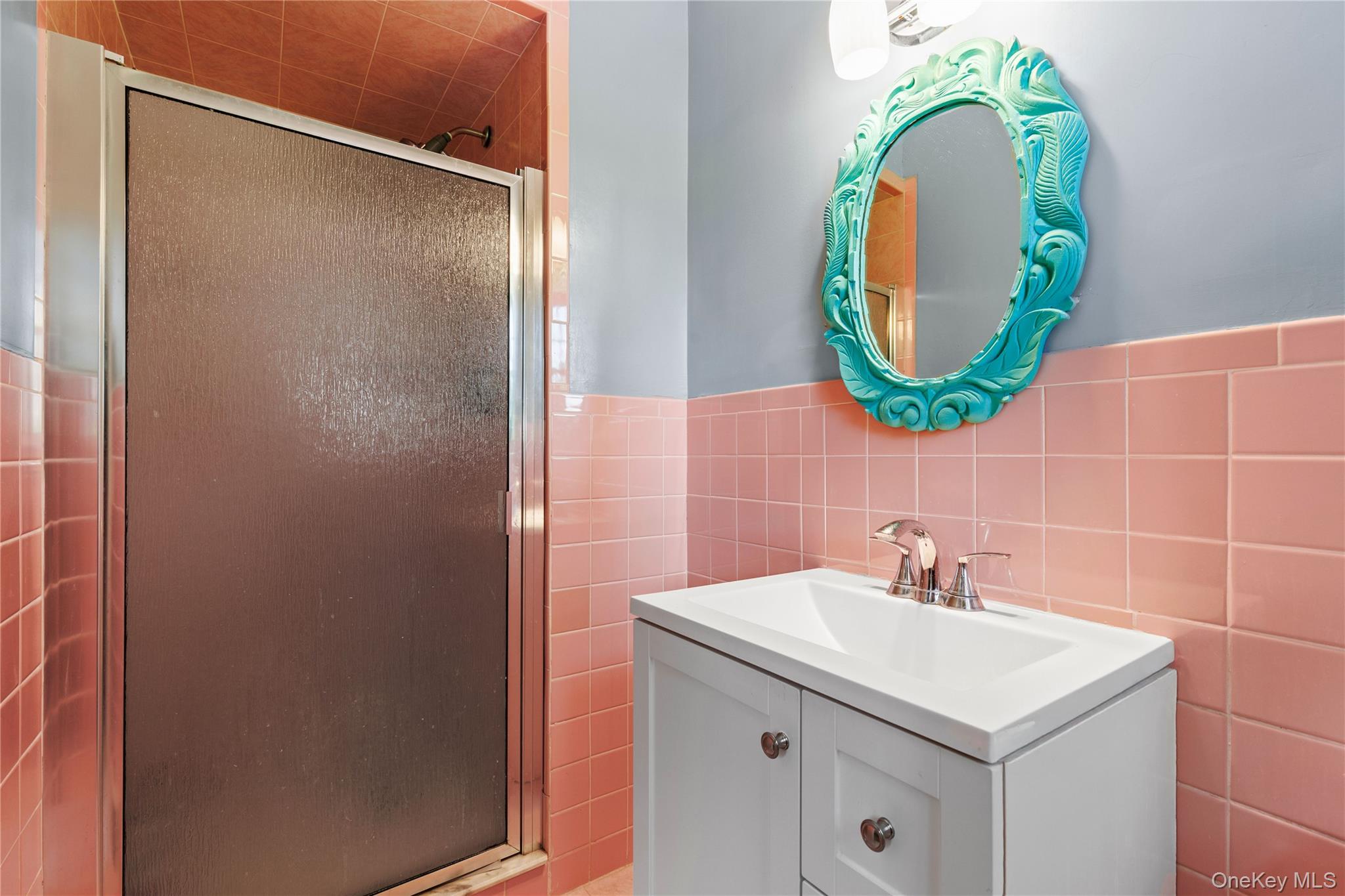 4 Mark Drive Rye Brook, NY 10573 - Photo 20 of 47 Bathroom with vanity, a stall shower, tile walls, and a wainscoted wall