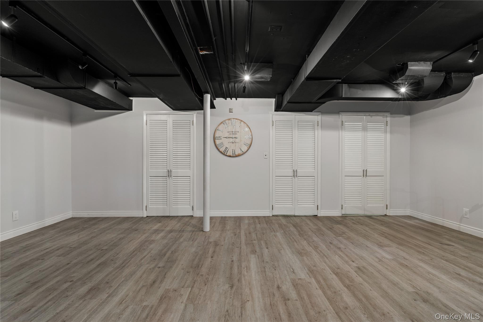 4 Mark Drive Rye Brook, NY 10573 - Photo 31 of 47 Finished below grade area with light wood-style floors and baseboards