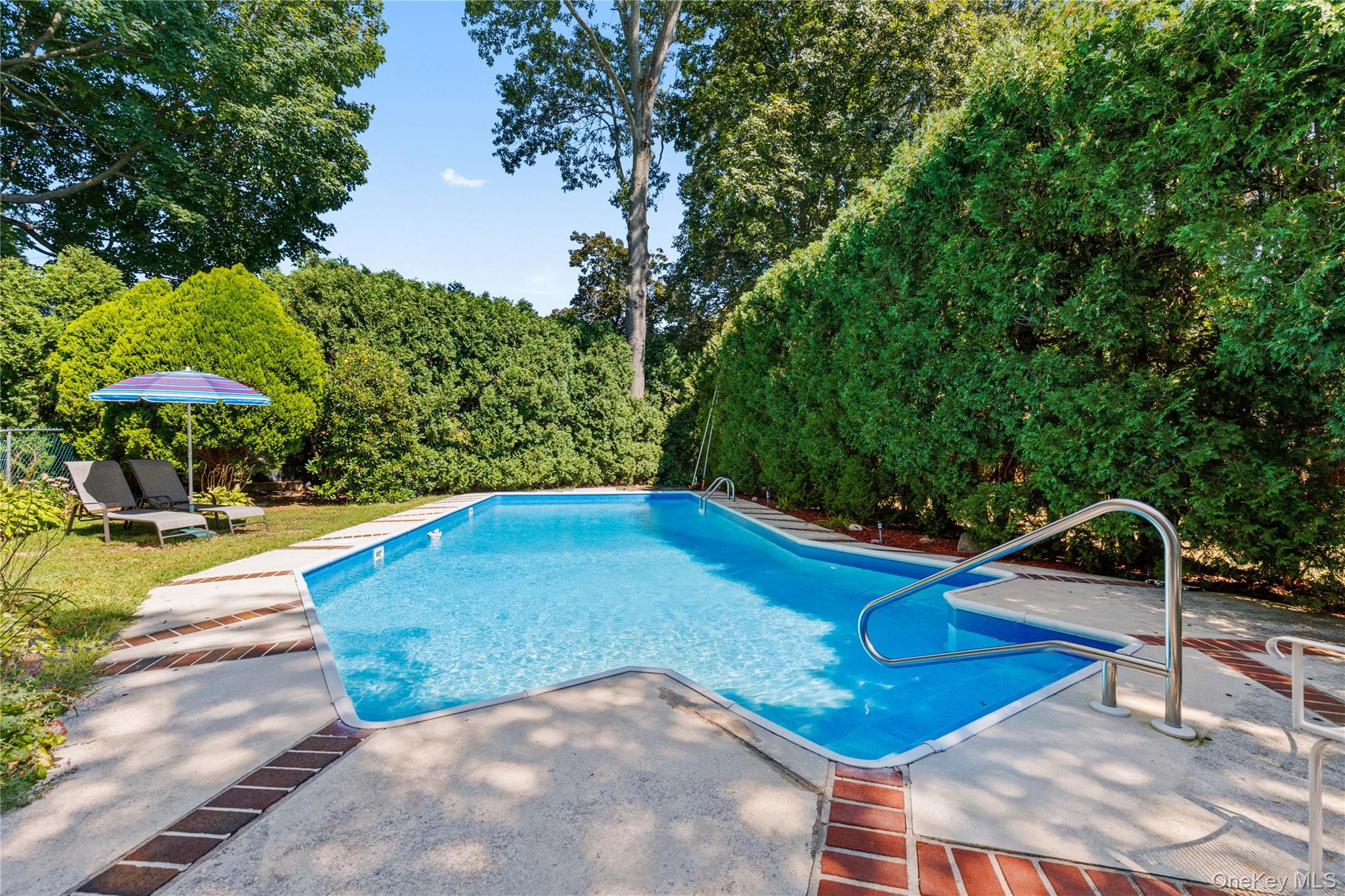 4 Mark Drive Rye Brook, NY 10573 - Photo 36 of 47 Outdoor pool featuring a patio area