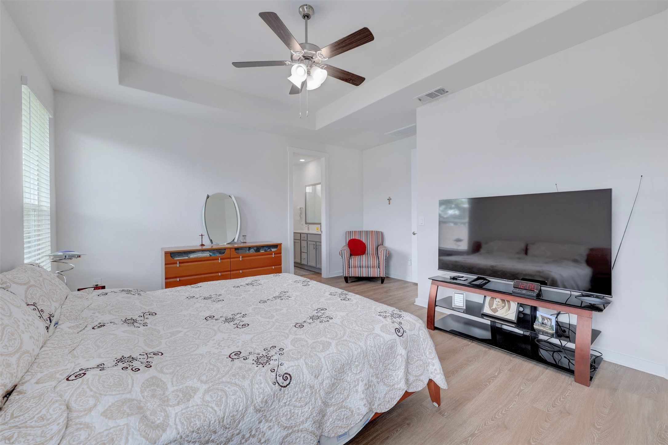 2041 Centerline Lane Georgetown, TX 78628 - Photo 18 of 31 a bedroom with a bed and a flat screen tv