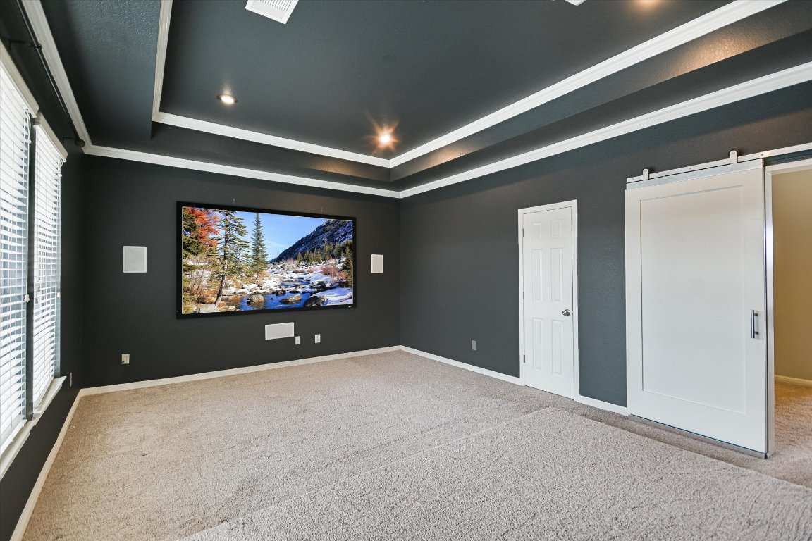 1911 Misty Ridge Leander, TX 78641 - Photo 17 of 30 a view of a projector room with furniture and screen windows