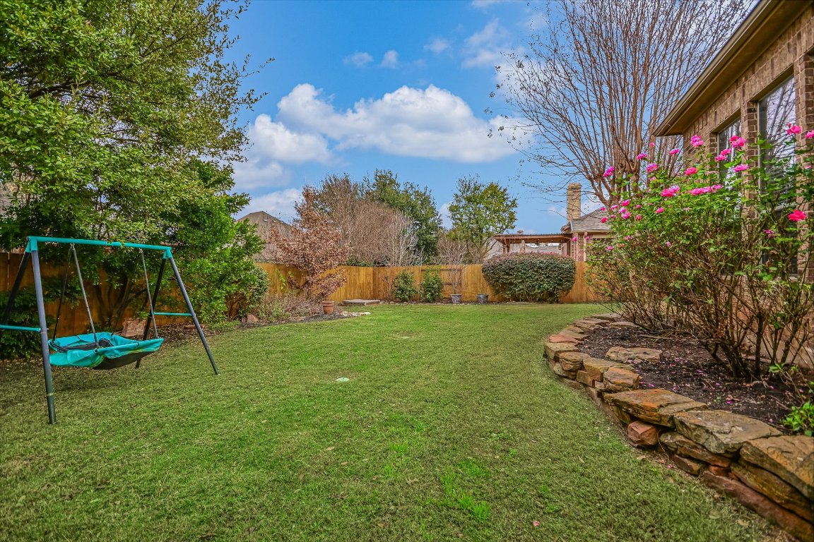 1911 Misty Ridge Leander, TX 78641 - Photo 26 of 30 a view of a yard with a tree