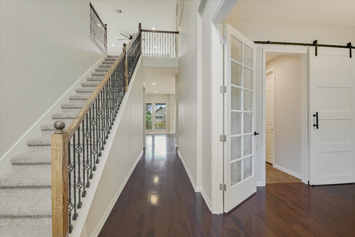 1911 Misty Ridge Leander, TX 78641 - Photo 4 of 30 a view of a hallway with wooden floor and entryway