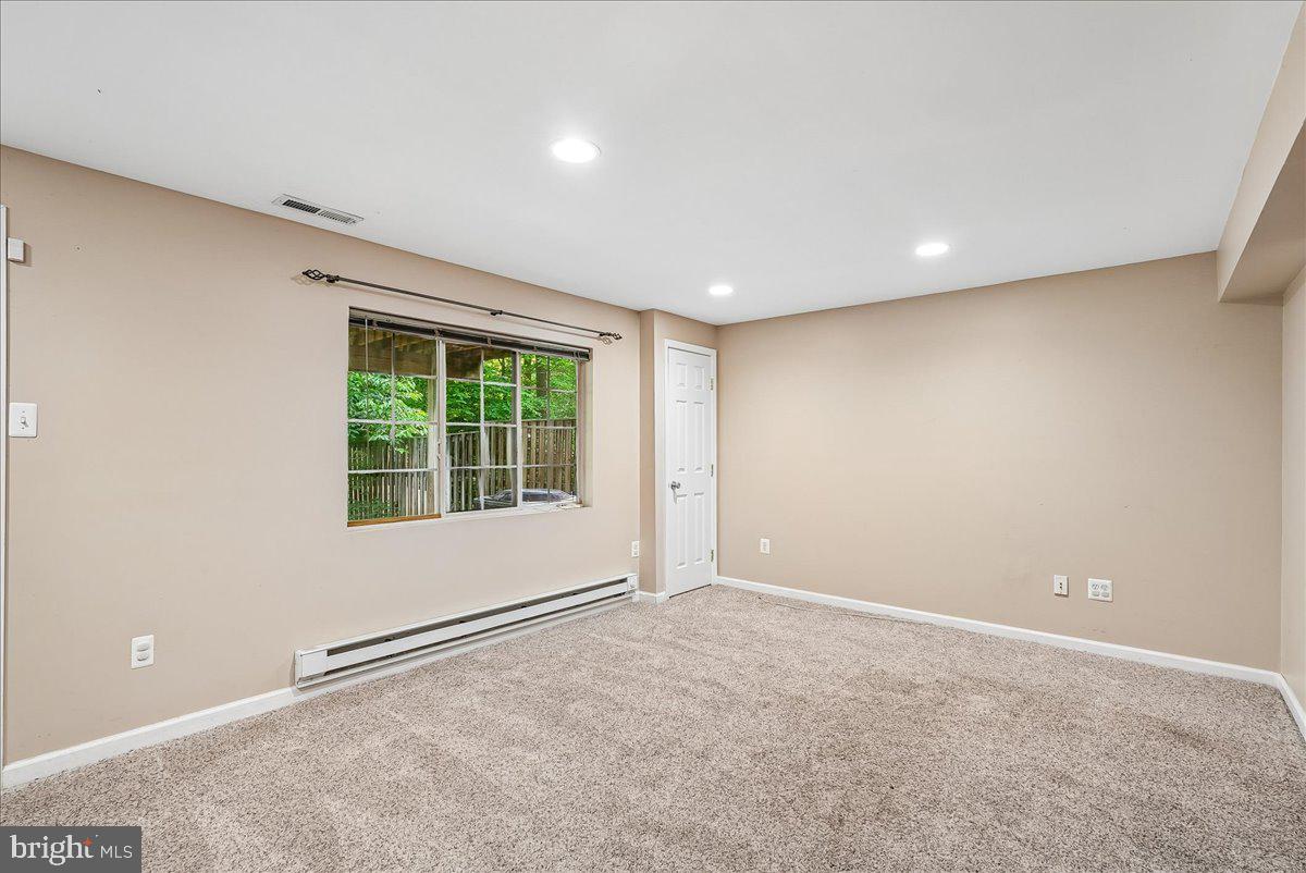 2331 Middle Creek Lane Reston, VA 20191 - Photo 42 of 78 a view of an empty room with a window