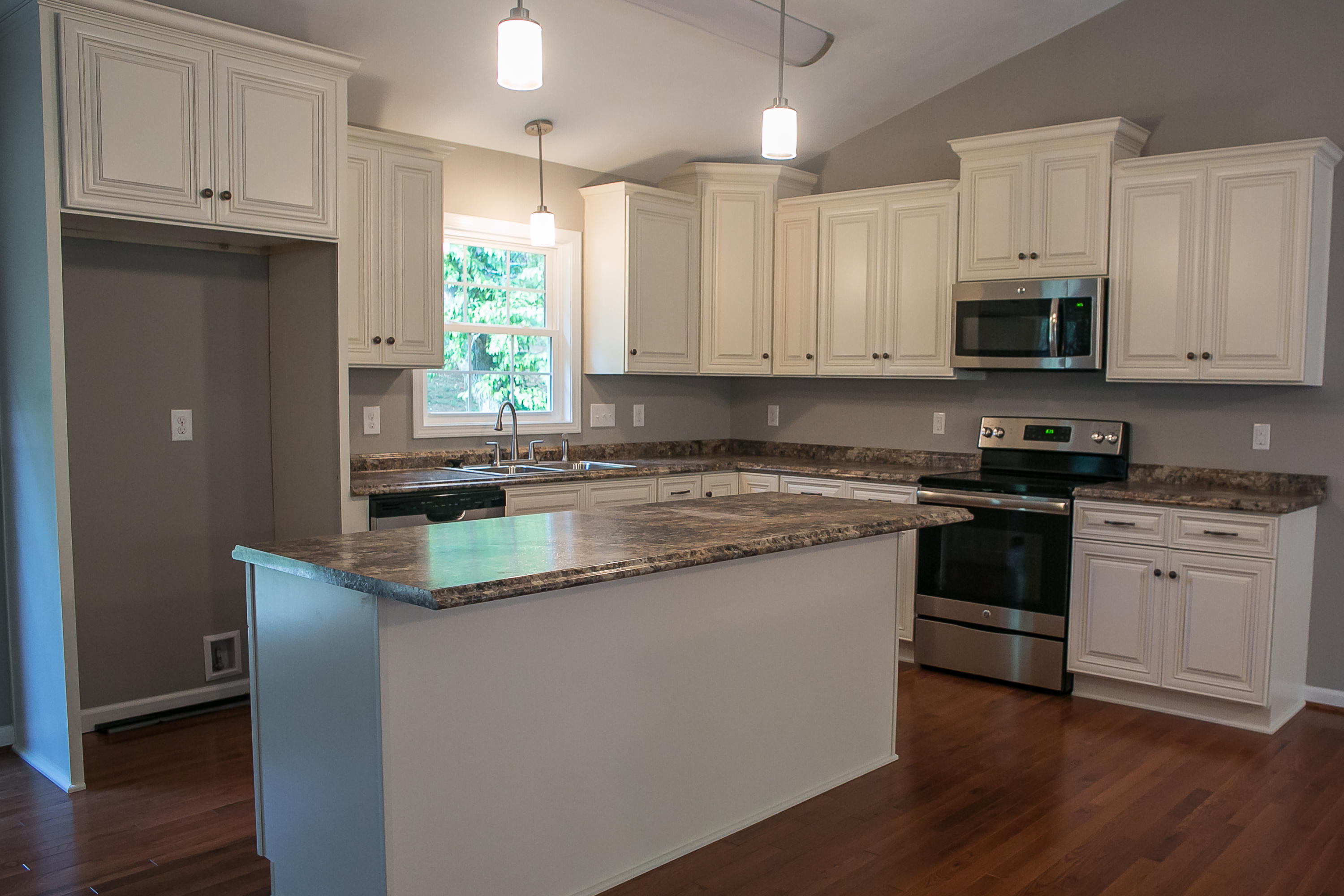 1824 Hardy Road Vinton, VA 24179 - Photo 2 of 13 a kitchen with granite countertop a sink cabinets and stainless steel appliances