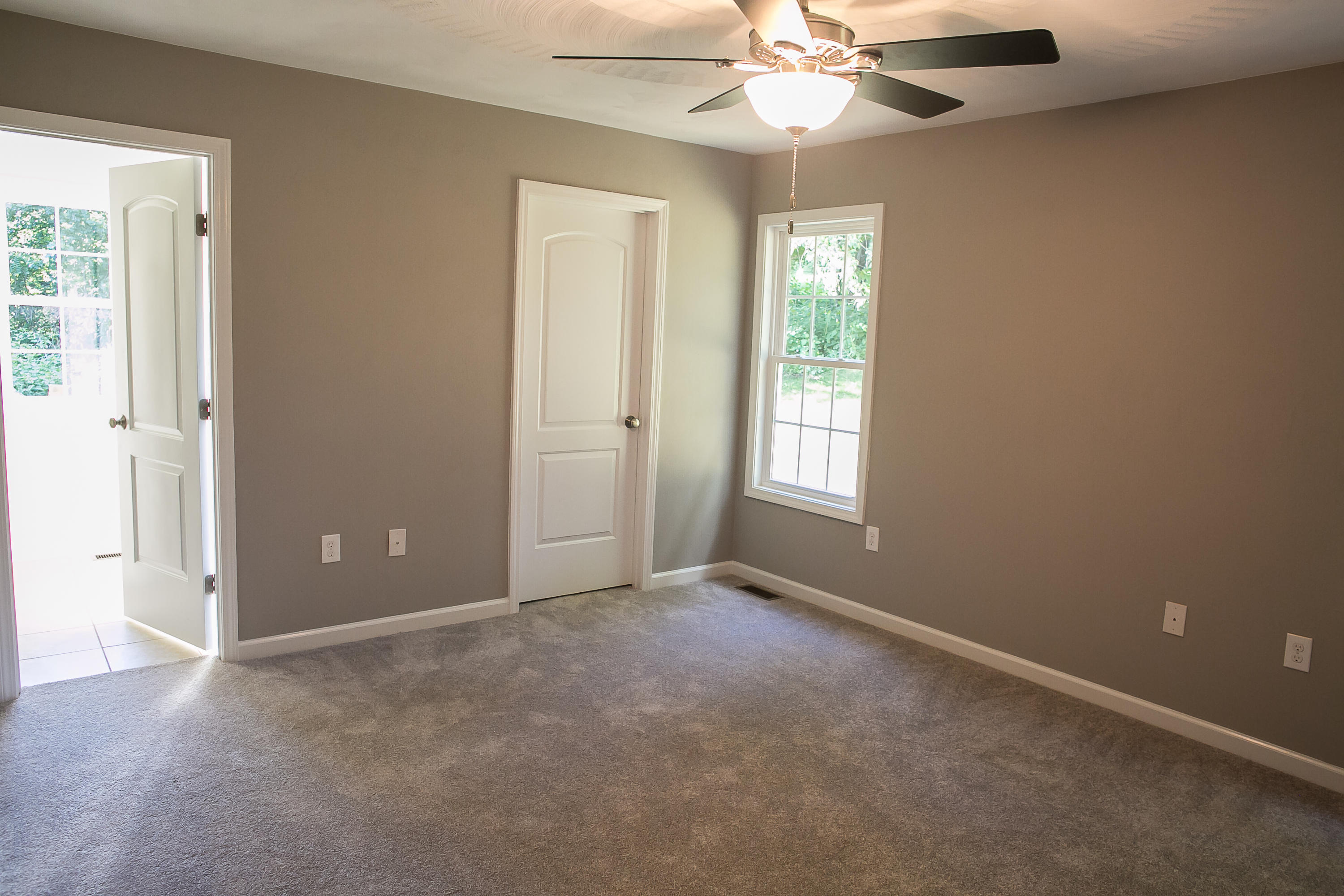 1824 Hardy Road Vinton, VA 24179 - Photo 4 of 13 an empty room with windows and fan