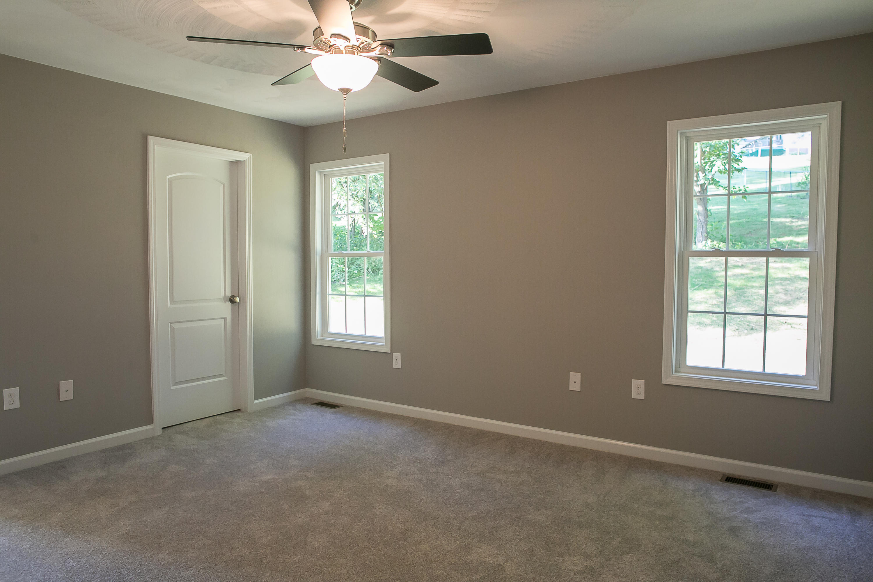 1824 Hardy Road Vinton, VA 24179 - Photo 7 of 13 an empty room with windows and fan