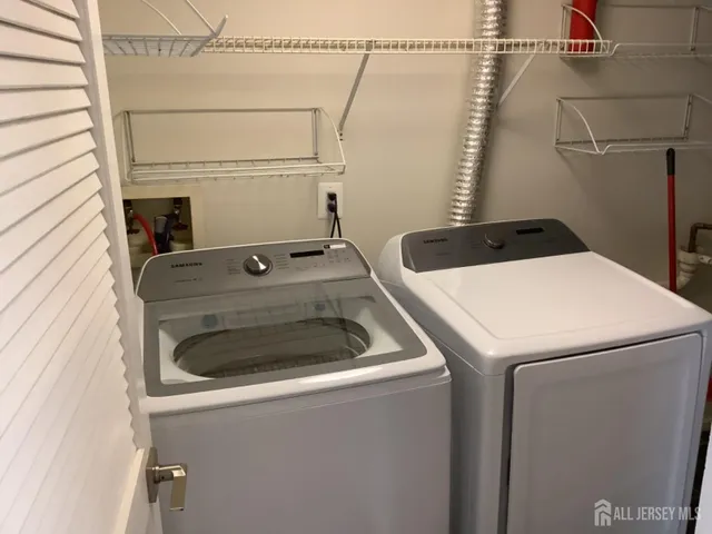 a utility room with dryer and washer