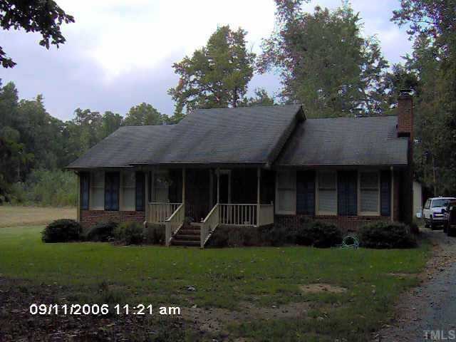 474 Winstead Loop Roxboro, NC 27574 - Photo 1 of 1 a view of a house with a garden