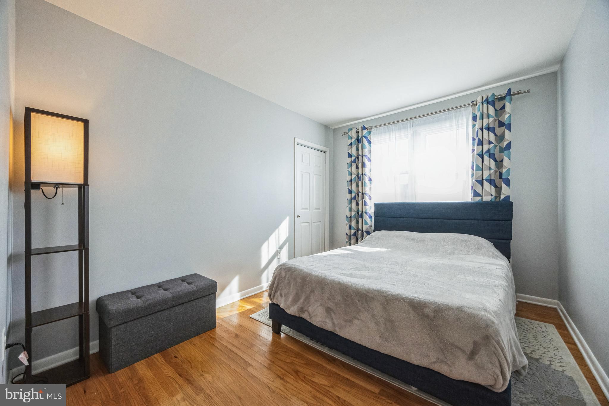 333 Davis Avenue Mount Ephraim, NJ 08059 - Photo 15 of 34 a bedroom with a bed and wooden floor