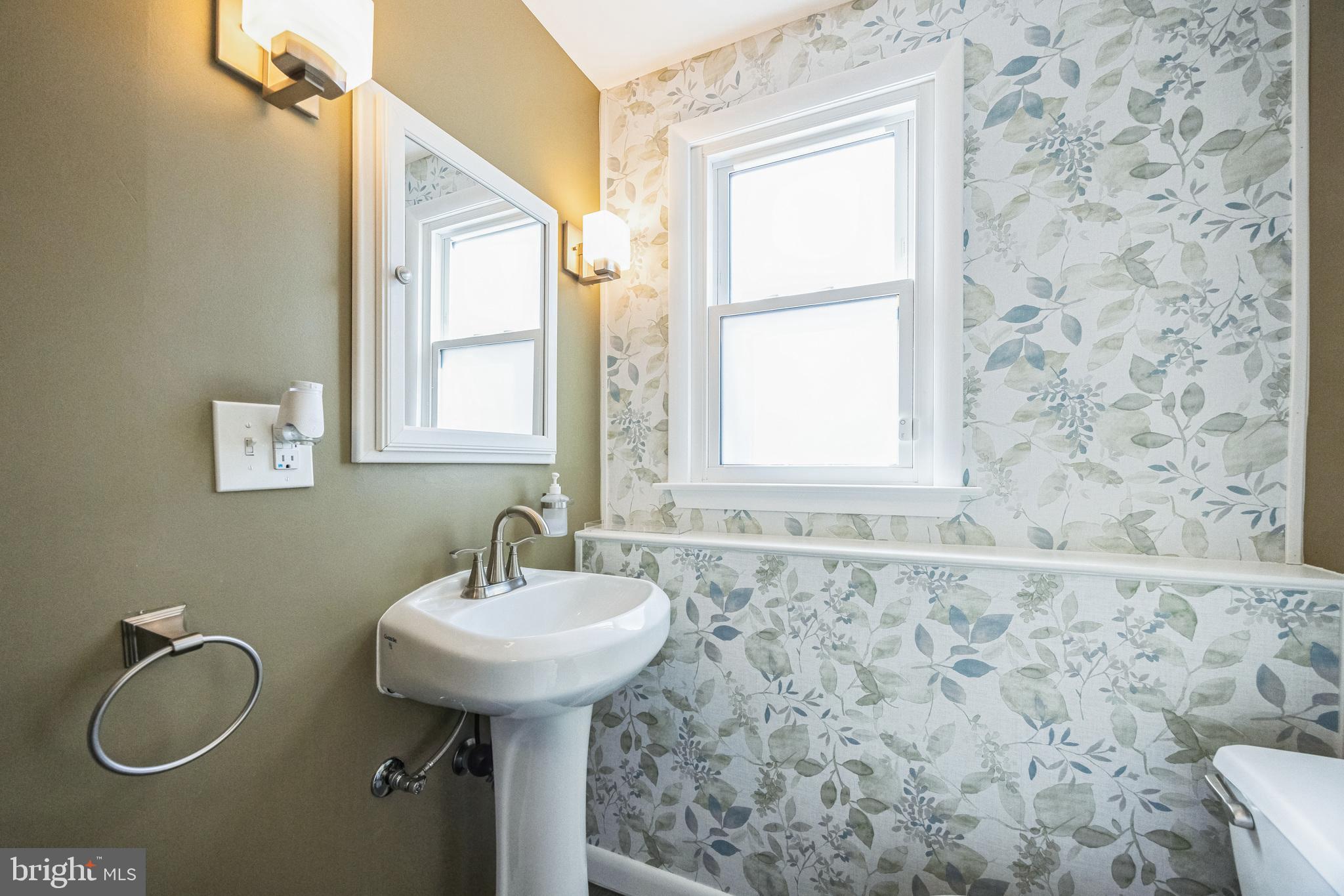 333 Davis Avenue Mount Ephraim, NJ 08059 - Photo 26 of 34 a bathroom with a sink a mirror and a window