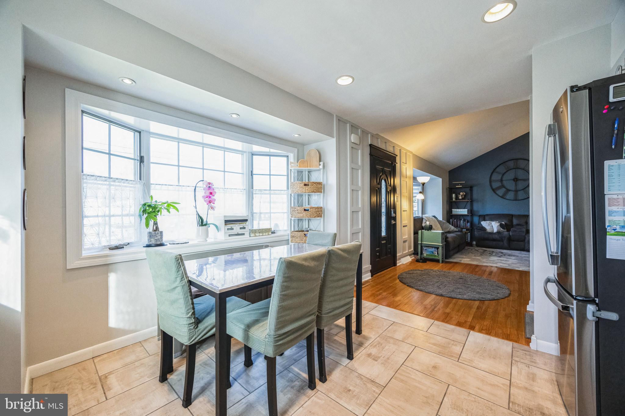 333 Davis Avenue Mount Ephraim, NJ 08059 - Photo 6 of 34 a dining room with furniture and a floor to ceiling window