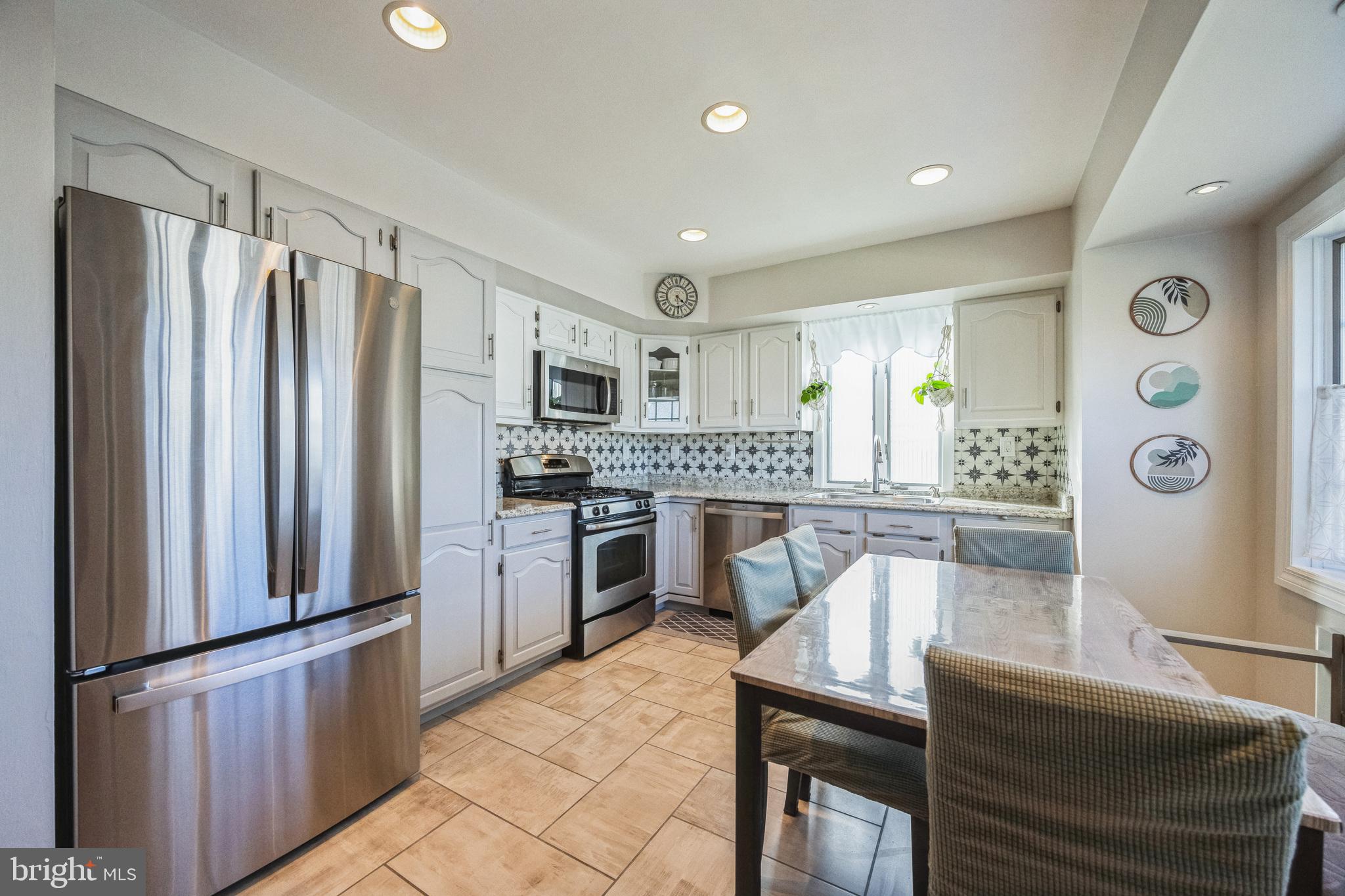 333 Davis Avenue Mount Ephraim, NJ 08059 - Photo 7 of 34 a kitchen with stainless steel appliances granite countertop a refrigerator and a stove top oven