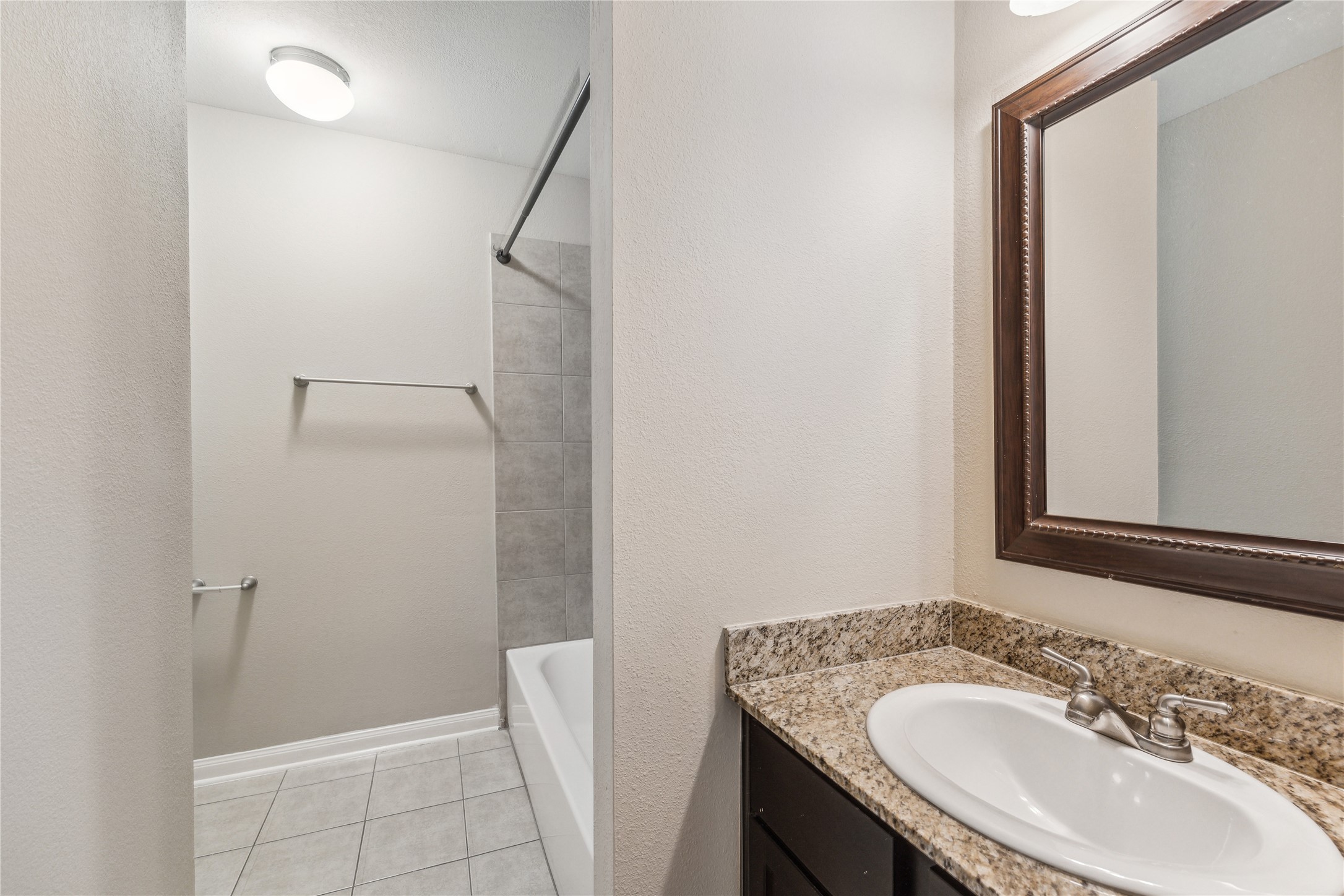 427 West 16th Street, Unit 2 Houston, TX 77008 - Photo 6 of 7 a bathroom with a sink and a mirror