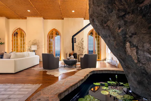 a view of a swimming pool with a yard and mountain view