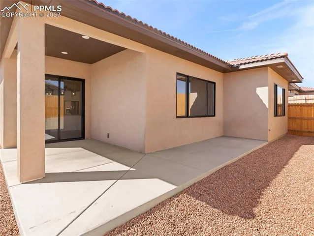 a view of living room with furniture and wooden floor