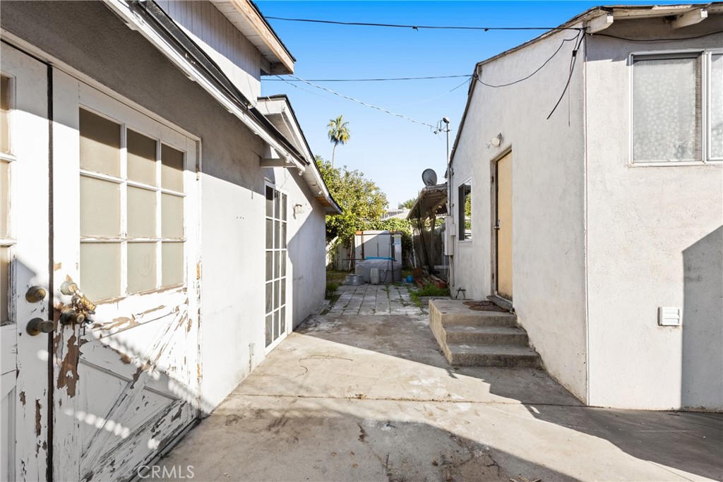 17415 Collins Street Encino, CA 91316 - Photo 11 of 14 a view of house with wooden floor and windows