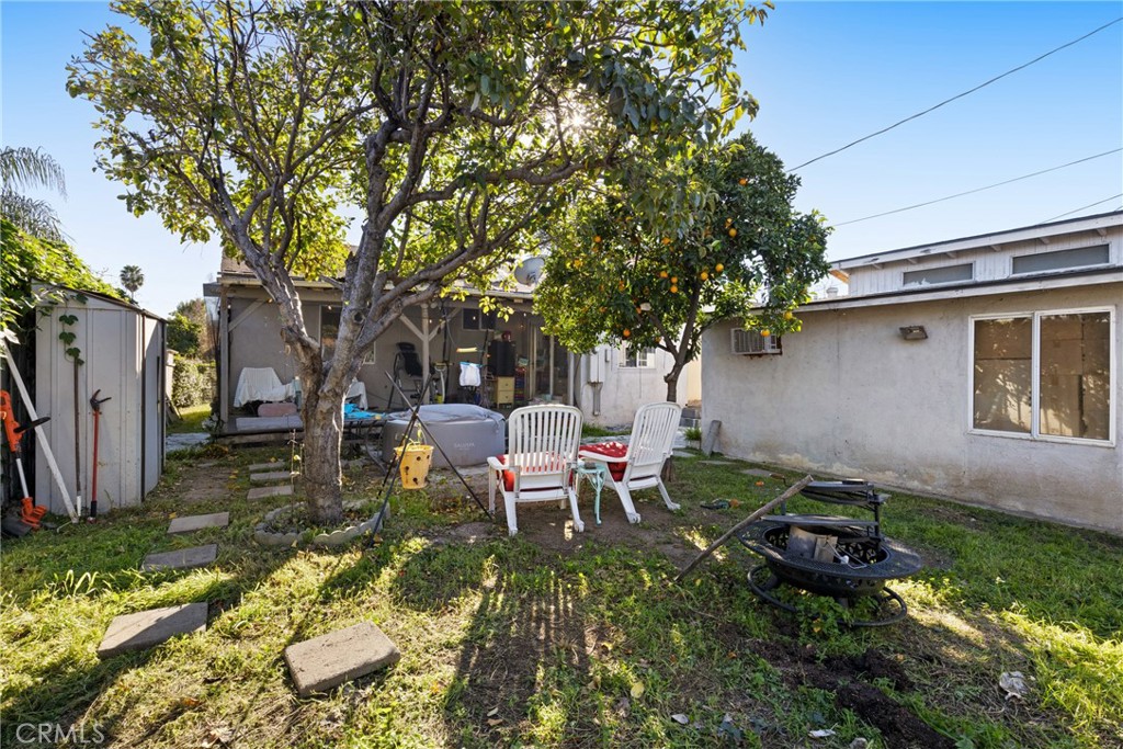 17415 Collins Street Encino, CA 91316 - Photo 13 of 14 a backyard of a house with yard and outdoor seating