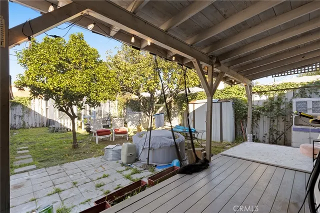 a view of a backyard with wooden floor