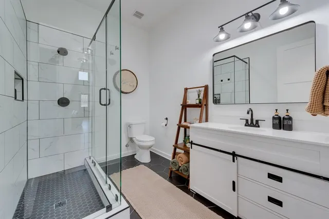 a utility room with sink dryer and washer