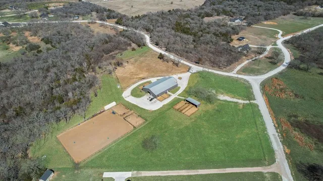 an aerial view of a house with pool